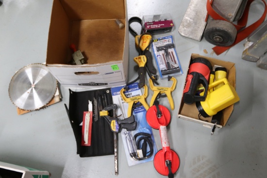 Miscellaneous tools including portable jigsaw attachment, table saw blades, four-piece router bit...