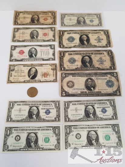 Old U. S. Paper currency and 1984 Olympic Coin