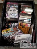 Bin of DVDs and CDs