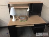 Office desk, lamp, toilet seat cover