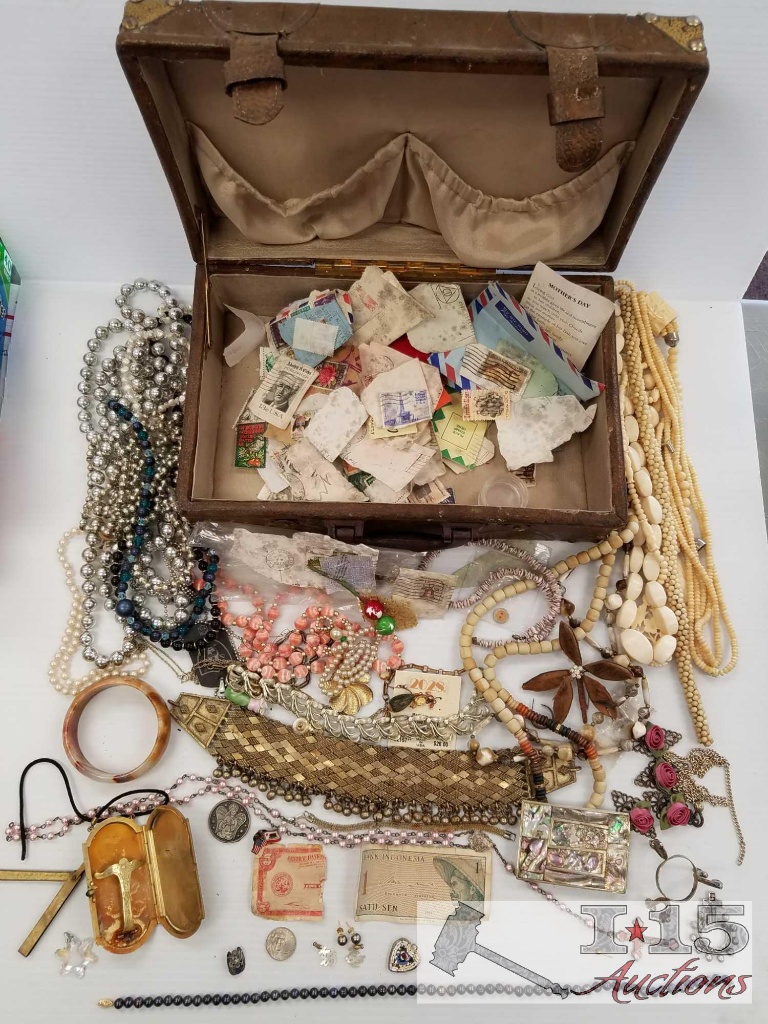 Vintage trunk full of cancelled stamps and costume jewelry