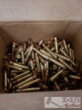 A Box of 30-06 brass and a Box of Brass Grommets and Washers
