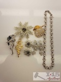 Brooches, Clip on Earrings and a Necklace