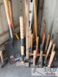 An assortment of Sledge Hammers, a Shovel and Level