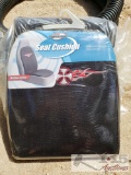 A Suction Hose and 2 Car Seat Cushions