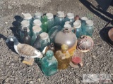 An assortment of Mason Jars, a Duck Statue and more