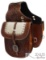 Tooled leather saddle bag with hair-on cowhide overlay.