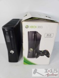 2 XBOX 360s, 1 in Box with 2 Controllers, Power Cord, 2 Games, and HDMI Cable