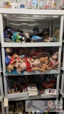 5 Shelves of Assorted E.T. Plush Toys, Books, Back Pack, KeyChains and More