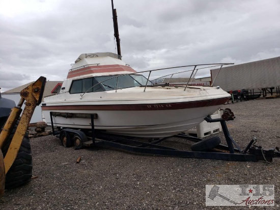 Reinell 247 boat on trailer