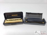 Two Hohner Harmonicas