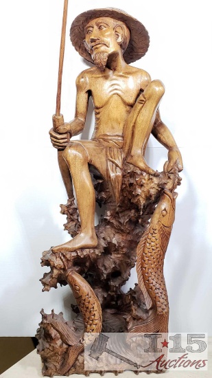 Hand Carved from Island Mahogany Wooden Fisherman with his catch.