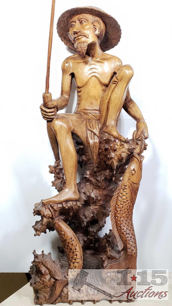 Hand Carved from Island Mahogany Wooden Fisherman with his catch.