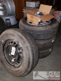 Three Stock Toyota Tundra Wheels, One Temp Use Wheel, Four Hubcaps