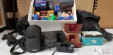 Various camera film, 4 camera cases, and 2 cameras