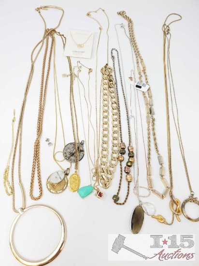 Approximately 12 necklaces of varied lengths and materials