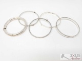 Five stackable silver bracelets