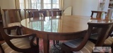 Beautiful genuine Baker Furniture Hepplewhite design oval dining table with 2 leafs & 10 matching