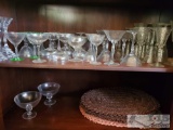 assorted glassware, stem ware, goblets, martini glasses, candlesticks, straw mats