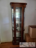 Antique cherry lighted curio cabinet