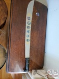 Machete knife with south American insignias, engraving.