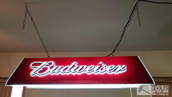 Budweiser pool light and approx. 8 various pool que's and a pool que rack