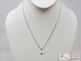14k Pearl and Diamond Pendent with chain Weighs Approx 2g