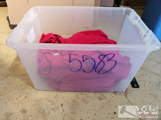 Tote Half Full of Colored Tank Tops