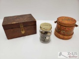 A Wooden Box With Metal Clasp, A Wooden Container Full of Coins, A Jar Full of Coins