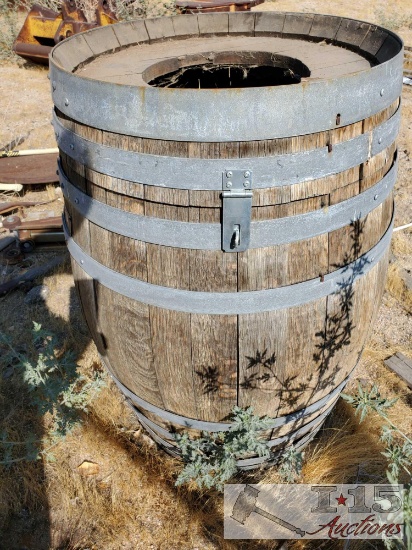 Two Antique Wheel Axles and Barrel