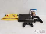 Play Station 4, 3 Controllers, Dragonball Xenoverse 2, And Pokemon Hat
