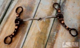 NEW Brown steel snaffle bit with engraved copper studs and silver accents on the cheeks.