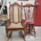 One Wooden Rocking Chair And One Small Cushioned Chair