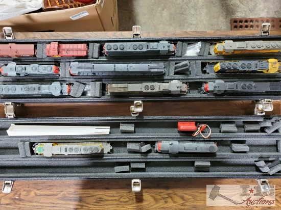 Case with 10 HO Scale Locomotives and 2 Cabooses
