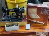 Singer sewing machine with attachments and phonograph