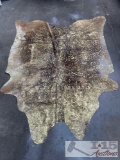 LG/XL Brazilian Acid Washed Gold on Brown cowhide rugs. Measures approximately 42.5-50 square feet.