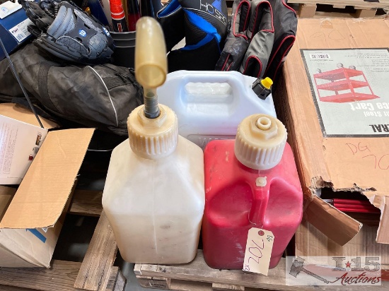 2 5 Gallon Gas Cans And 1 6.5 Gallon Water Can