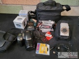 Canon Video Camera, Canon Digital Camera, Olympus Film Camera, and Accessories