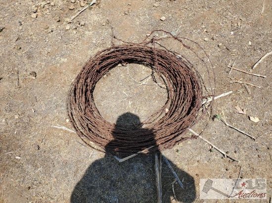 Roll Of Barb Wire And 4 T Posts