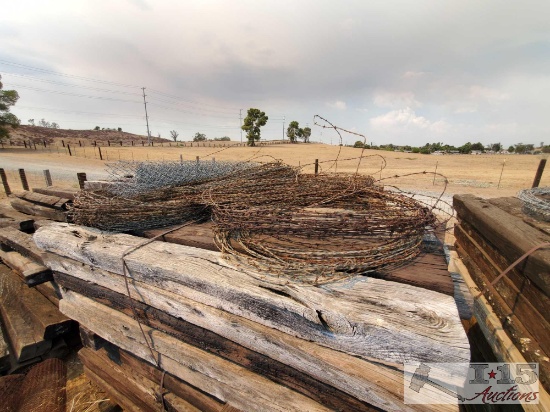 Bundle Of Barbed Wire And Chain Link Fence