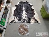 Cow Hide and Circle Made of Feathers