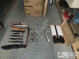 (8) Knives, (2) Axes, Hand Cuffs & Whip