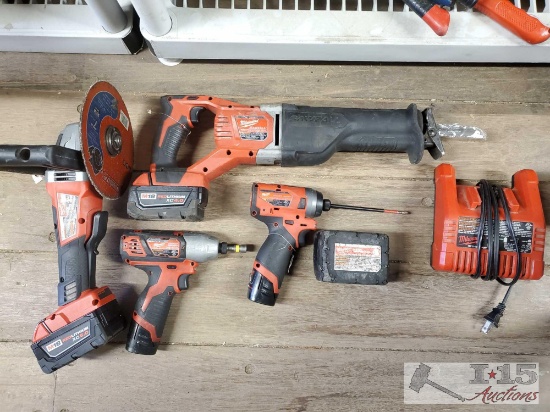 Milwaukee Grinder, Sawsawll, 2 Impact Drivers, Battery pack, and Charger