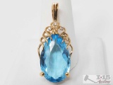 14k Gold Pendant With Diamonds and Topaz Stone , 8.3g