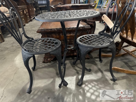 small metal table with 2 chairs