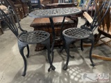 small metal table with 2 chairs