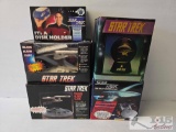 (3) Star Trek Talking Alarm Clocks, (1) Star Trek Lighted Star Globe, and (1) Star Trek It's a Disk
