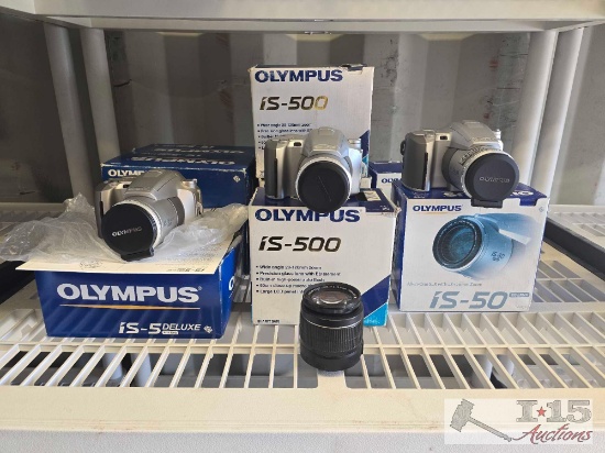 (10) Olympus Cameras and (1) Canon 58mm Camera Lense