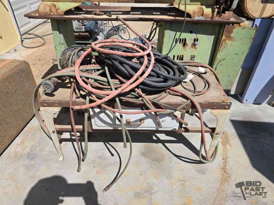 Air Hose, Electric Wire, Grinder and Metal Table with Wooden Top