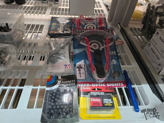(5) Slingshots, (2) Shingshot Ammo, and (1) Voodoo Tactical Pen
